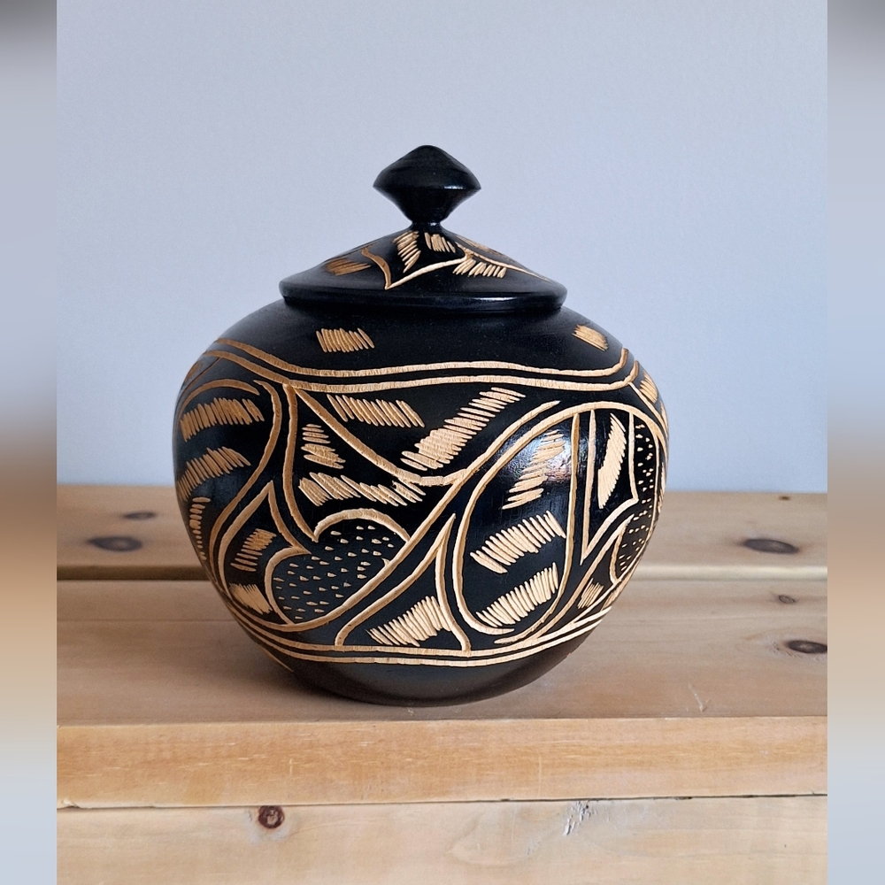 Jar with carved wooden lid